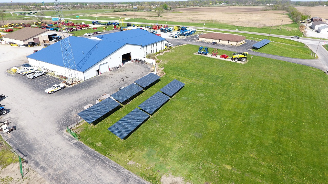 Solar array beside a dealership building